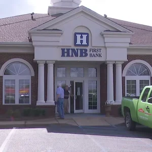 headland national bank building with people and cars