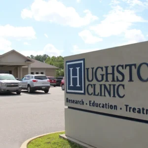 hughston clinic signage with building and cars